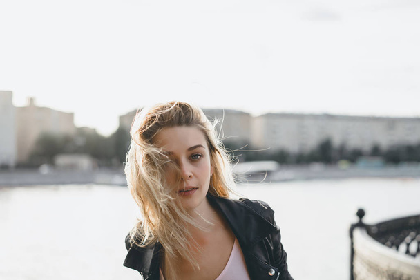 blonde woman posing at urban promenade - Valokuva, kuva