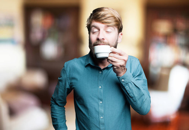 young blonde man with a coffee - Фото, зображення