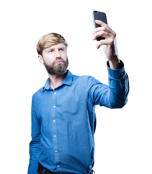 young blonde man with mobile phone - Fotoğraf, Görsel