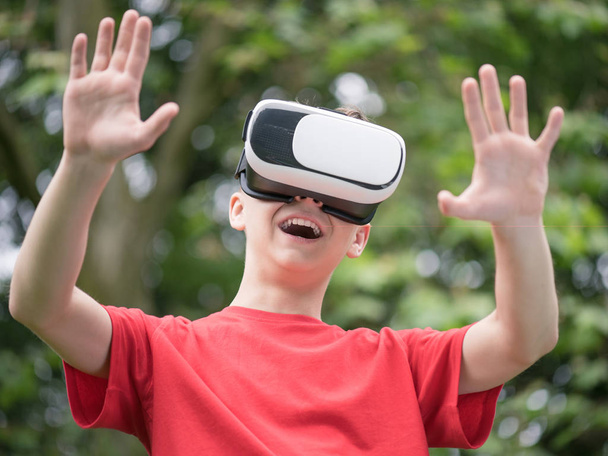 Teen boy with VR glasses - Photo, Image