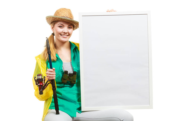 Happy woman with fishing rod holding board - Foto, immagini