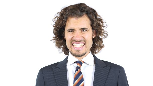 Uomo d'affari arrabbiato Rettifica denti, Capelli ricci
 - Foto, immagini
