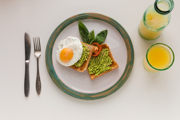 fried egg and avocado on toasts - Photo, Image