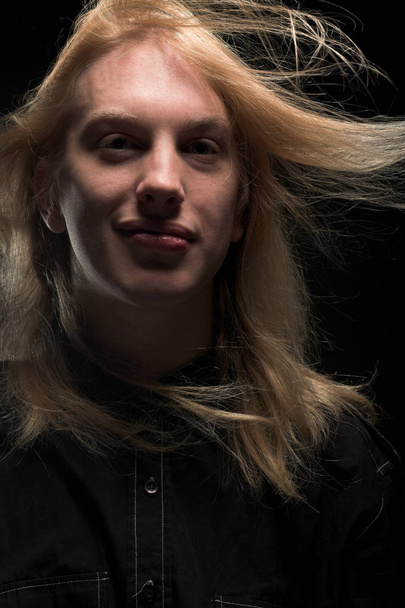 Young man with long blond hair - Fotoğraf, Görsel