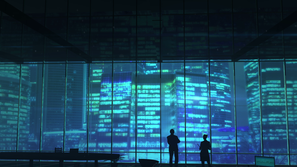 Silhouettes dans un immeuble de bureaux contre des gratte-ciels
 - Séquence, vidéo