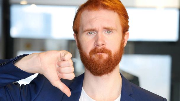 Thumbs Down by Businessman with Red Hair, Beard - Photo, Image