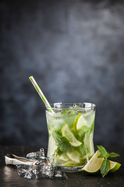Mojito cocktail on dark background - Fotó, kép