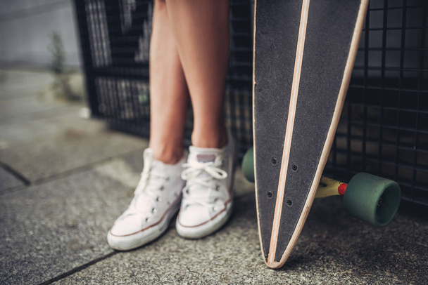 Female teenager with skateboard - Valokuva, kuva