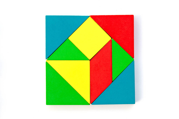 Wooden colorful toy block in multiple shape build to square design on white background - Photo, Image