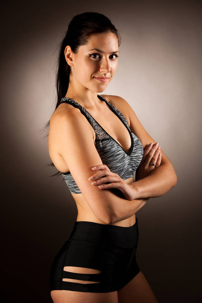 Active young fit woman pose in studio - Foto, afbeelding