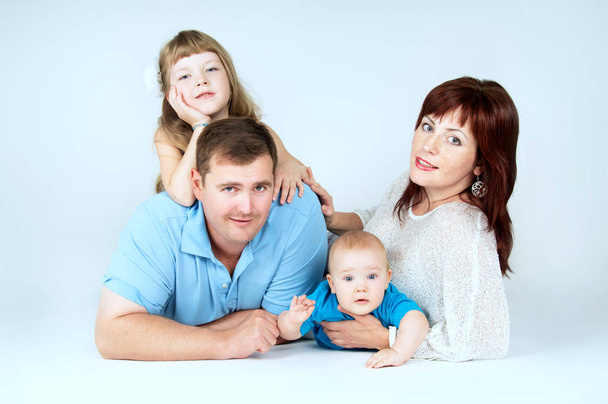 Beautiful young family with young children - Foto, Bild