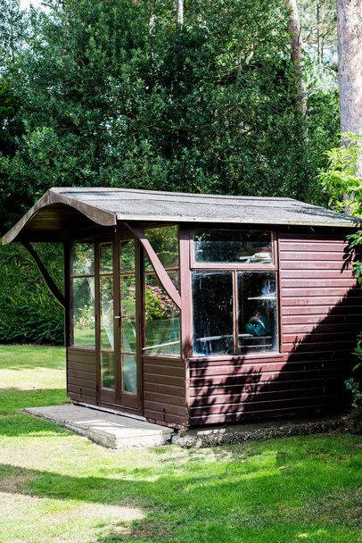 Wooden Glazed Garden Shed In An English Garden - Photo, Image