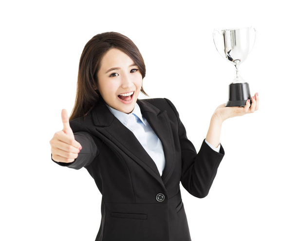 Gelukkig zakenvrouw opdagen trophy en duim - Foto, afbeelding