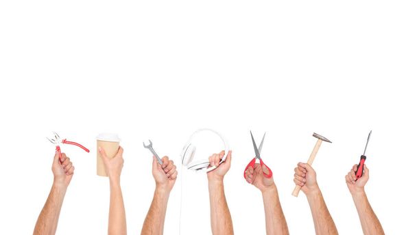 hands holding tools and objects  - Foto, imagen