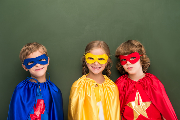 kids in superhero costumes - Фото, изображение
