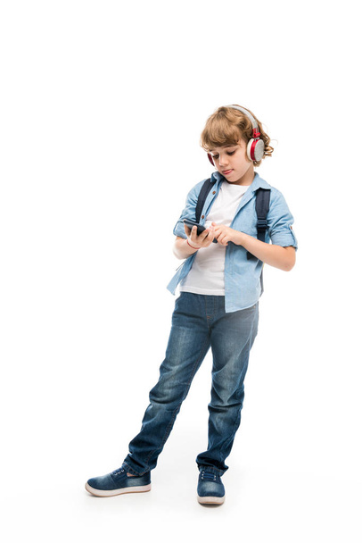 schoolboy with smartphone and headphones - Фото, изображение