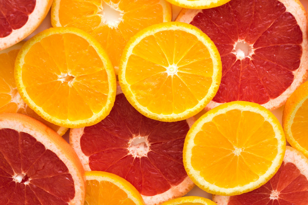 Naranja en rodajas y pomelo
 - Foto, Imagen