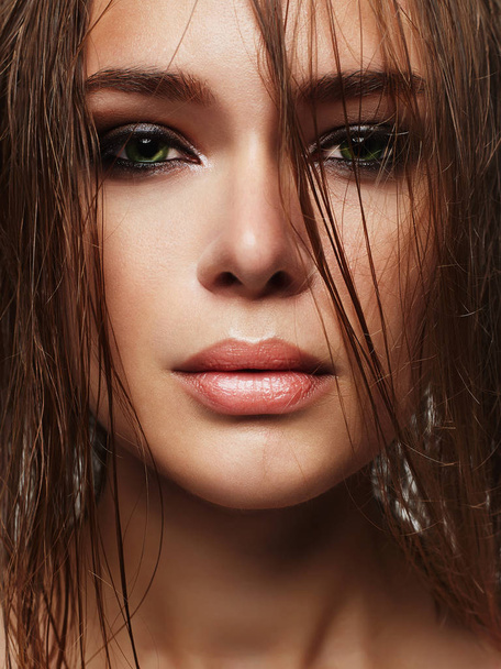 Beautiful woman with wet hair and make-up - Fotó, kép