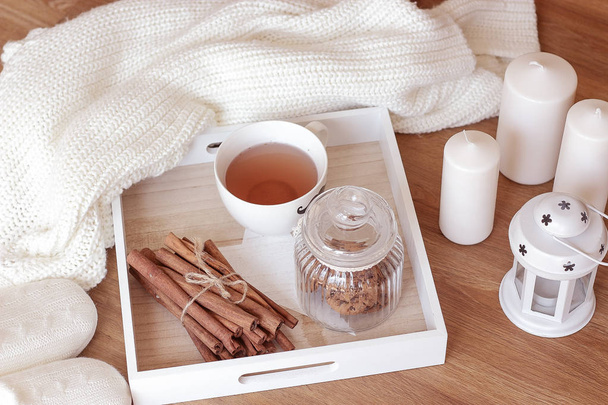 Cozy autumn. Home cosiness. Knitted plaid, hot tea, biscuits. Warm winter. - Photo, Image