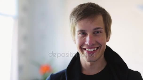 portrait of happy smiling young man indoors - Filmagem, Vídeo