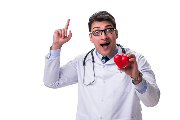 Young male cardiologist doctor holding a heart isolated on white - Φωτογραφία, εικόνα