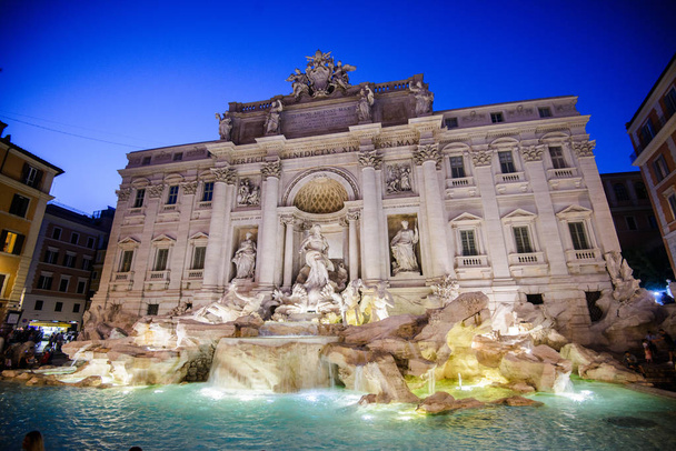 Trevi fountain at sunrise, Rome, Italy. Rome baroque architecture and landmark. Rome Trevi fountain is one of the main attractions of Rome and Italy - Photo, Image