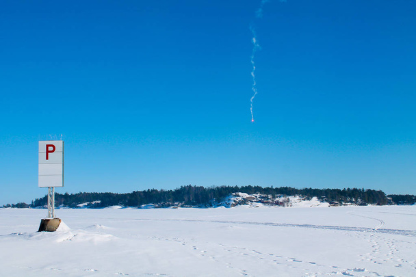 Emergency red rocket falling on ice - Photo, Image