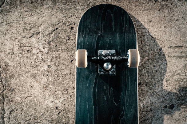 Skateboard on concrete floor in skatepark - Photo, Image