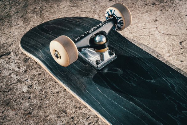 Skateboard on concrete floor in skatepark - Photo, Image