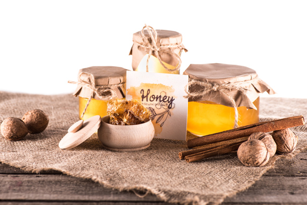 honey in glass jars and card - Foto, imagen