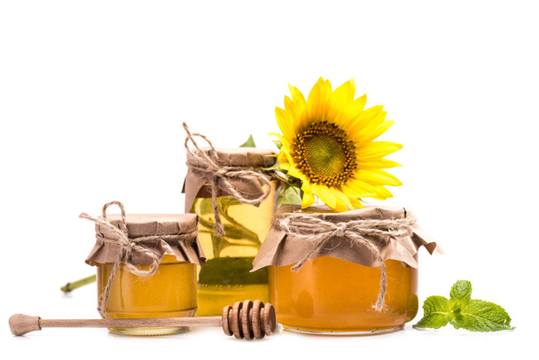 sunflower and honey in glass jars  - Photo, Image