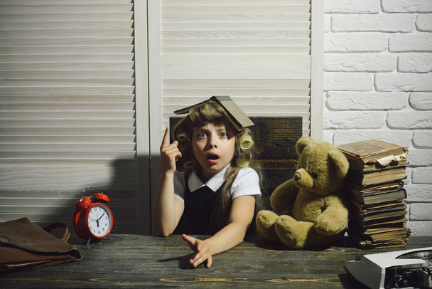 child with bear and alarm clock - Фото, зображення