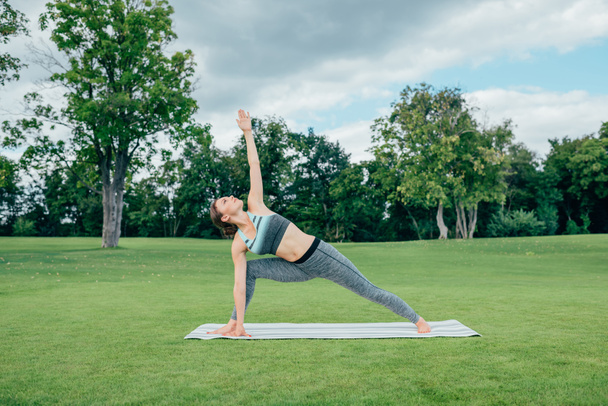 caucasian woman practicing yoga pose - Photo, Image