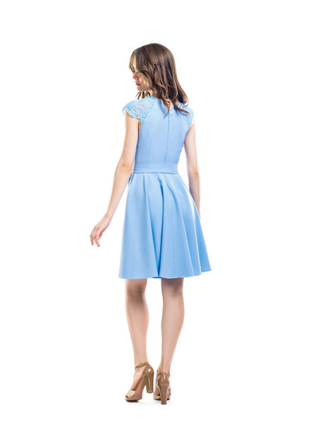 Back view of young beautiful woman in blue dress - Photo, image