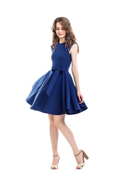 Happy beautiful woman in blue dress posing in studio - Фото, изображение