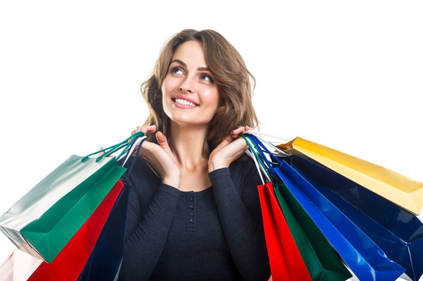Young beautiful woman holding many colorful shopping bags - Zdjęcie, obraz