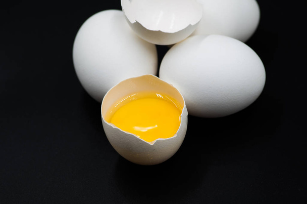 fresh eggs on the black background - Photo, Image