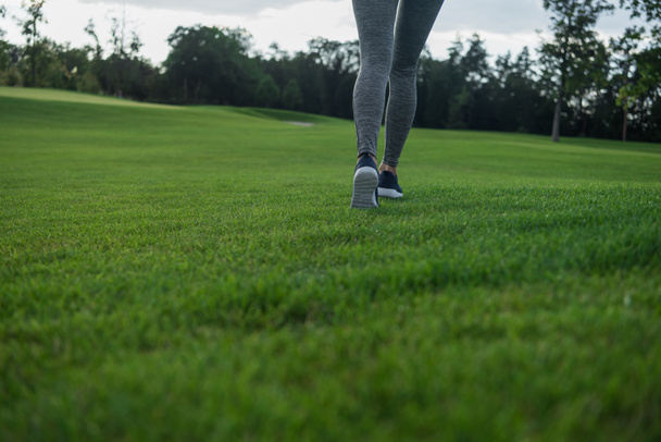 woman running on green lawn - Photo, Image