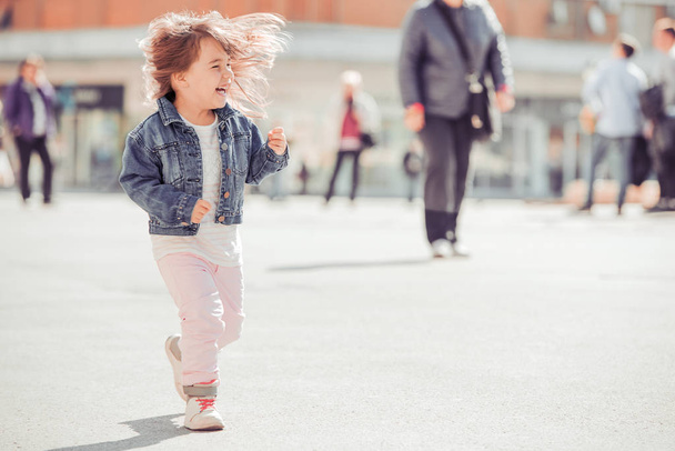 Portrait of adorable little girls outdoors in city - Фото, зображення
