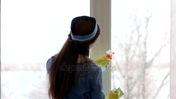 Housemaid is washing window. - Footage, Video