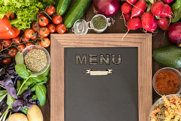 chalkboard with group of fresh vegetables  - Photo, Image