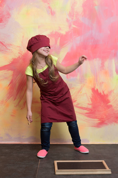 Girl cook having fun in chef hat and apron - Fotoğraf, Görsel