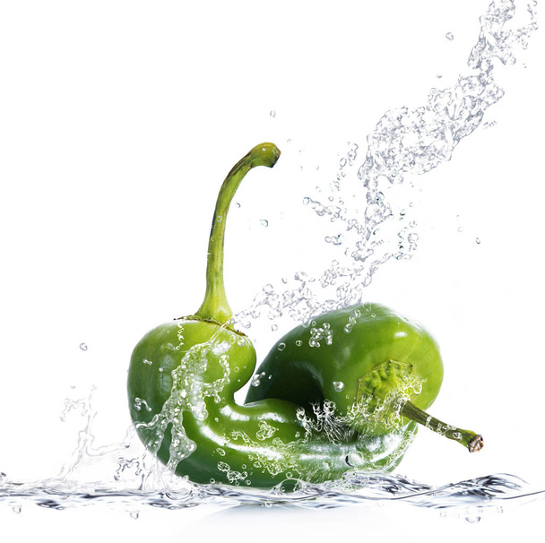 fresh peppers falling in water - Fotoğraf, Görsel