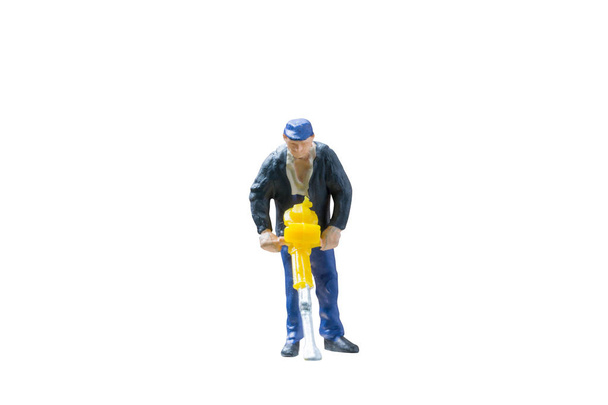 Miniature people worker construction concept on isolate white background - Zdjęcie, obraz