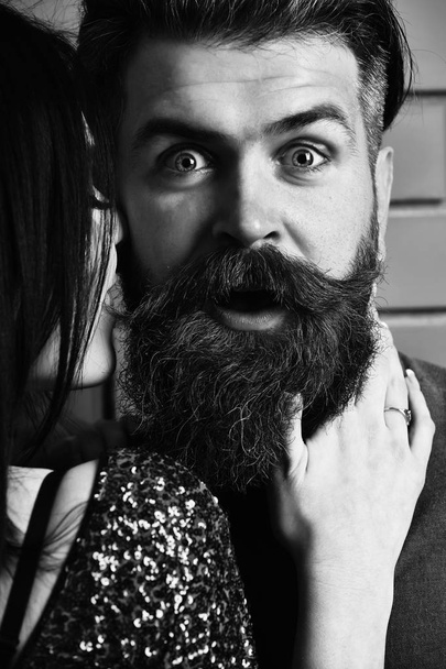 surprised bearded man and pretty sexy woman - Foto, Bild