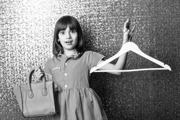 small pretty surprised girl with red leather bag and hanger - Photo, Image