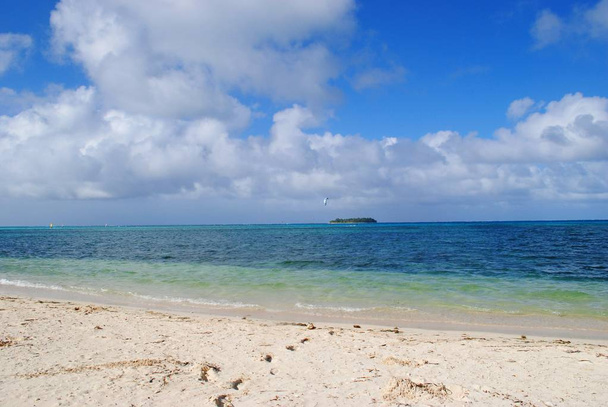 Micro Beach in Garapan, Saipan with its soft white sand, pristine blue waters and the Managaha Island in the distance - Photo, Image