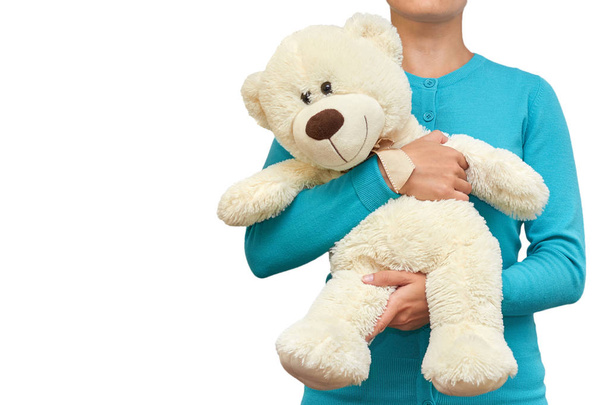 Girl with a teddy bear in her hands. isolated on white background - Φωτογραφία, εικόνα
