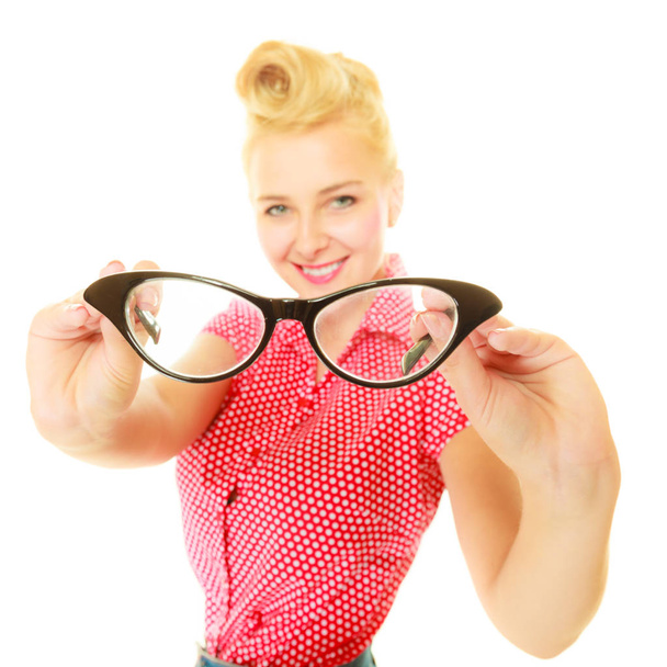 Blonde pin up girl holding retro glasses - Fotó, kép