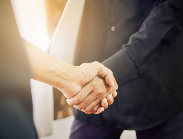 Businessmen are shaking hands after successful negotiations in business, The concept of business advancement through collaboration. vintage effect. - Photo, Image